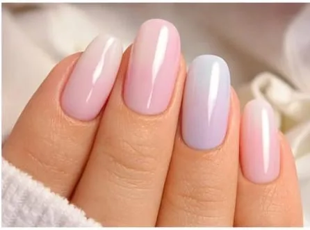 Milky pastel nails in soft pink and lilac with a glossy finish